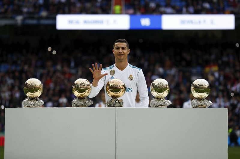 Cristiano Ronaldo poses with his five Ballon d'Or awards